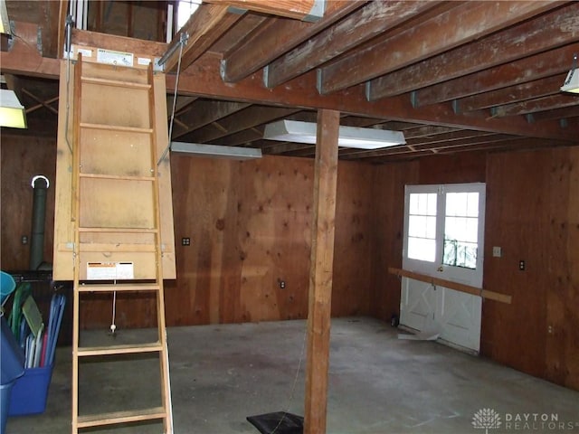 miscellaneous room with wooden walls