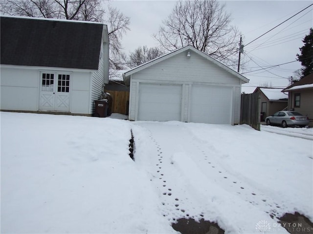 view of snow covered garage