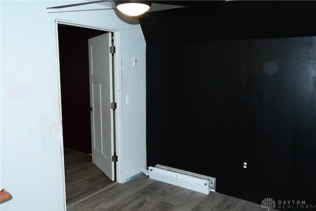 spare room featuring ceiling fan, hardwood / wood-style floors, and lofted ceiling