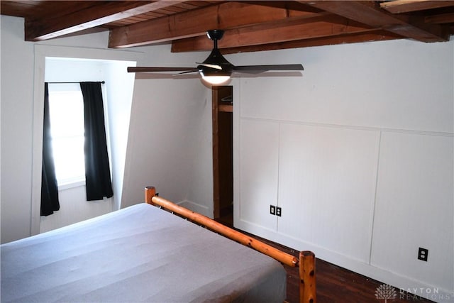 unfurnished bedroom with ceiling fan, beam ceiling, and wood ceiling