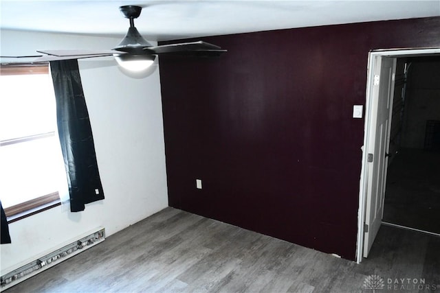 empty room with hardwood / wood-style flooring