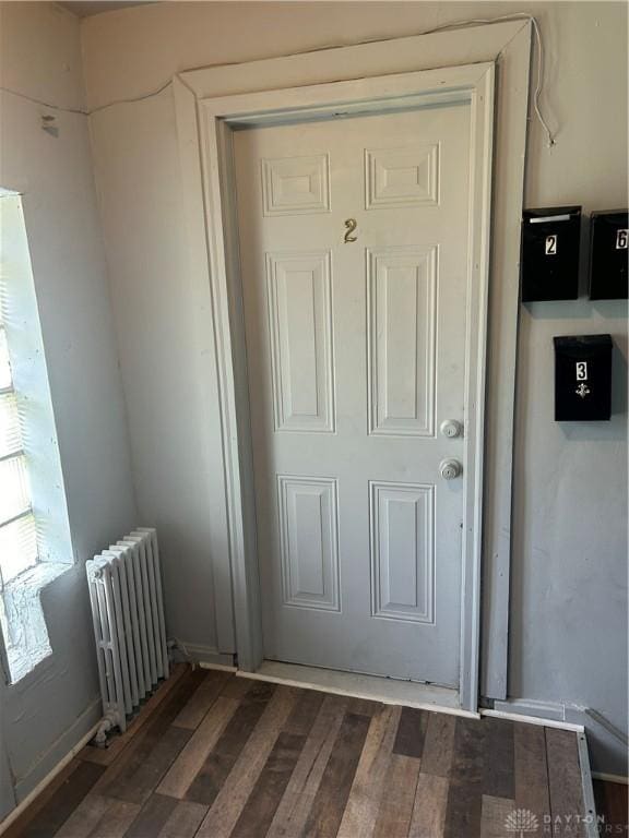 entrance to property featuring radiator