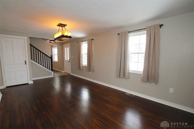 foyer with dark hardwood / wood-style floors