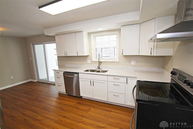 kitchen with white cabinetry, sink, wall chimney range hood, and appliances with stainless steel finishes