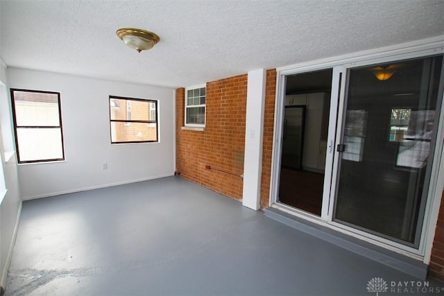 spare room with a textured ceiling