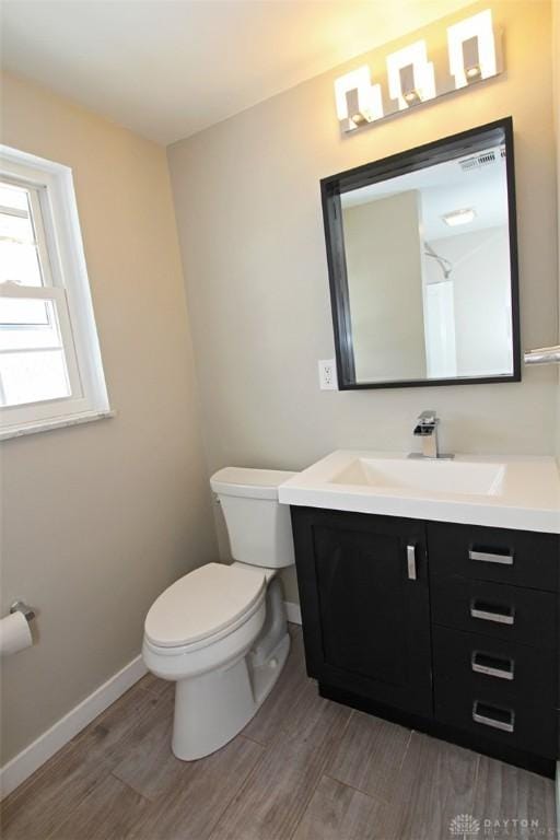 bathroom with toilet and vanity