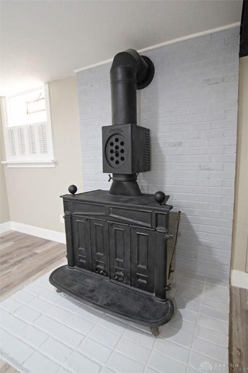 details with wood-type flooring and a wood stove