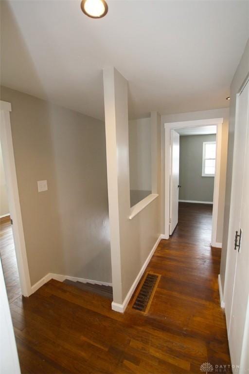 hallway featuring dark hardwood / wood-style floors