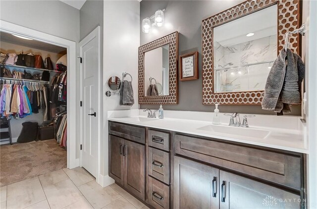 bathroom featuring an enclosed shower and vanity