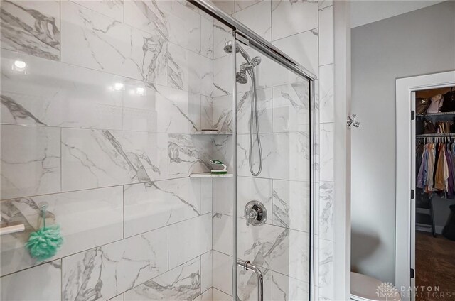 bathroom featuring ceiling fan, tile patterned floors, an enclosed shower, and vanity