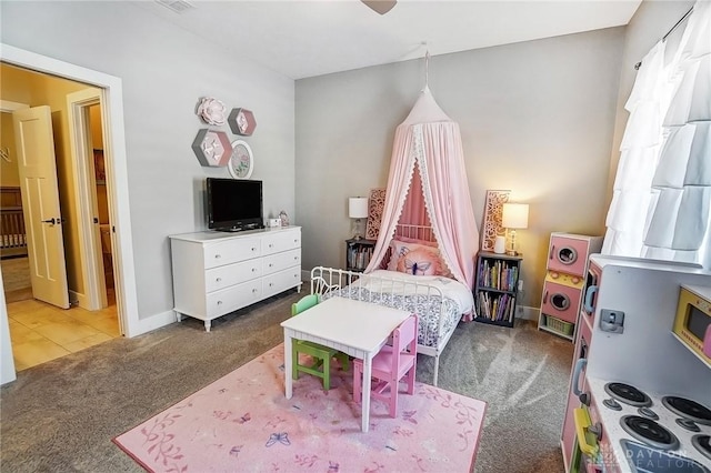 carpeted bedroom with ceiling fan