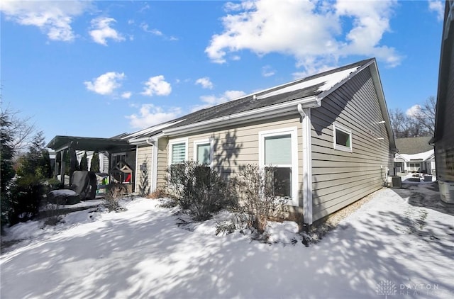 view of snow covered exterior with central air condition unit