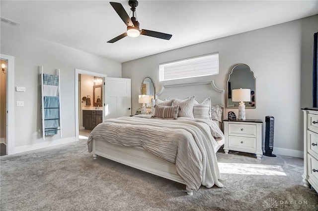 bedroom with carpet flooring, connected bathroom, and ceiling fan