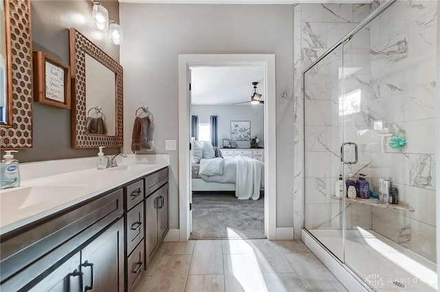 bathroom featuring vanity, ceiling fan, and a shower with shower door