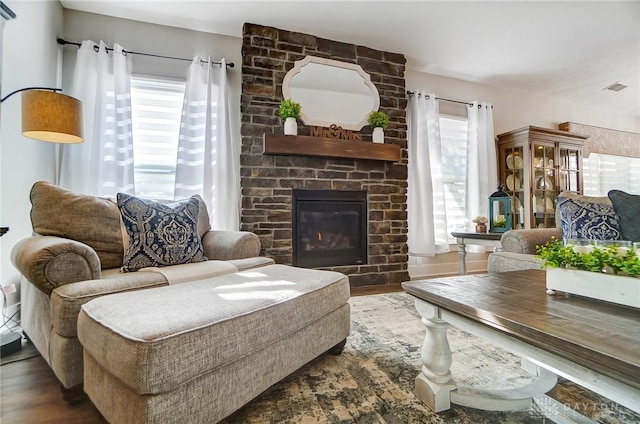 living room with a fireplace and dark hardwood / wood-style floors