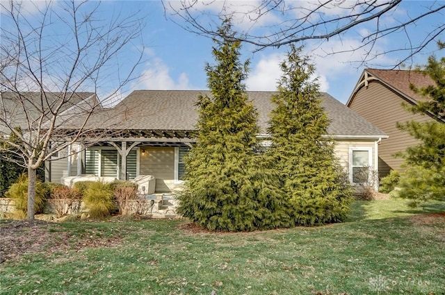 view of property exterior with a lawn