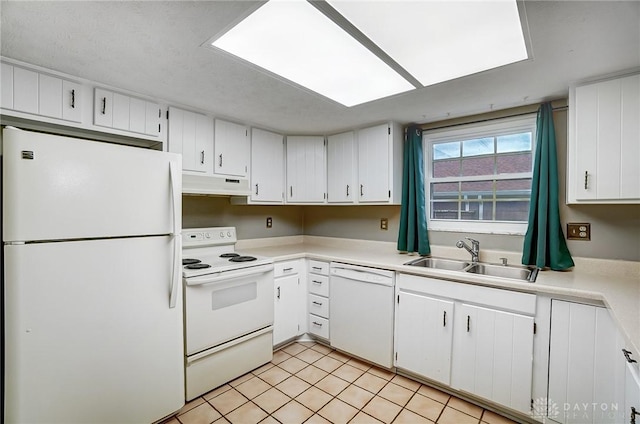 kitchen featuring white cabinetry, sink, white appliances, and light tile patterned flooring