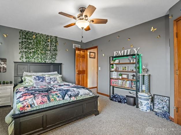 bedroom featuring ceiling fan and carpet floors