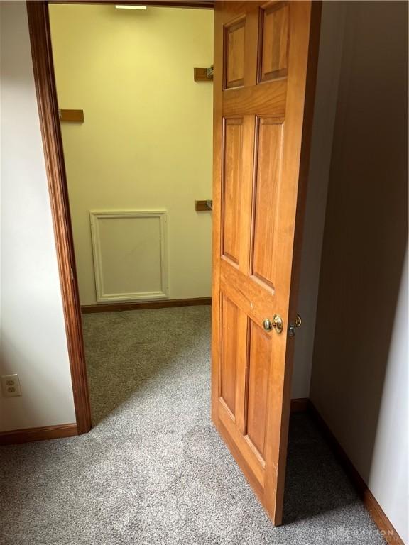 hallway with carpet