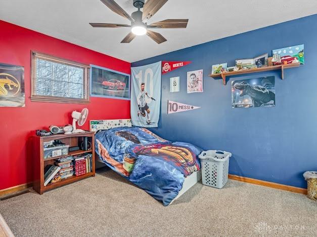 bedroom with ceiling fan and carpet floors