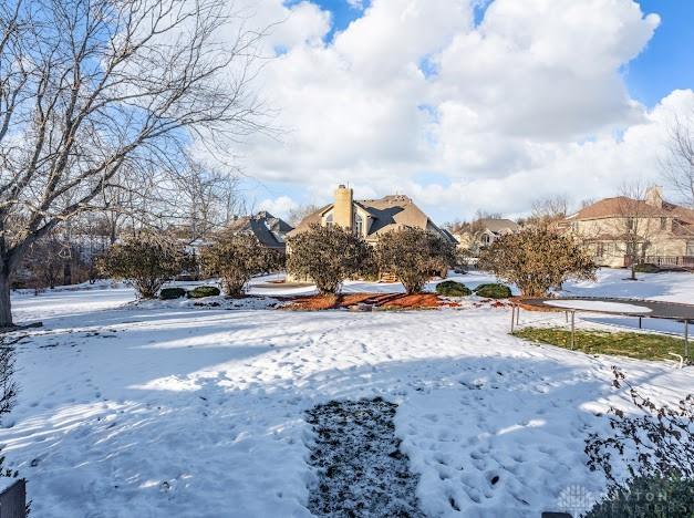 view of yard layered in snow