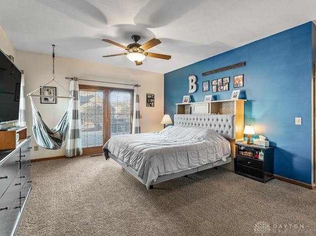 carpeted bedroom featuring ceiling fan