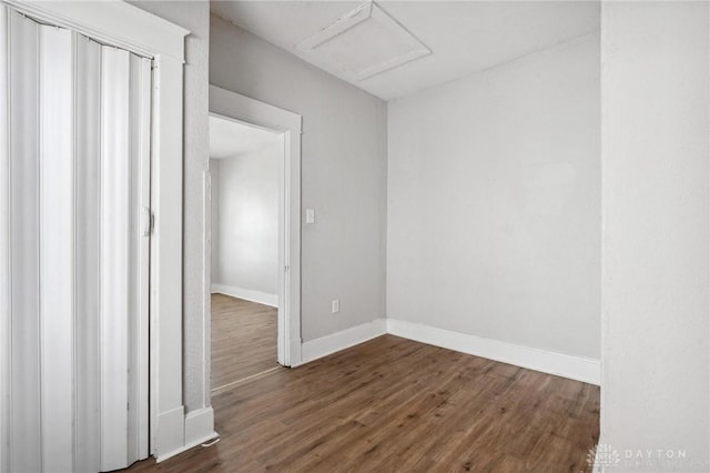 empty room featuring dark hardwood / wood-style flooring