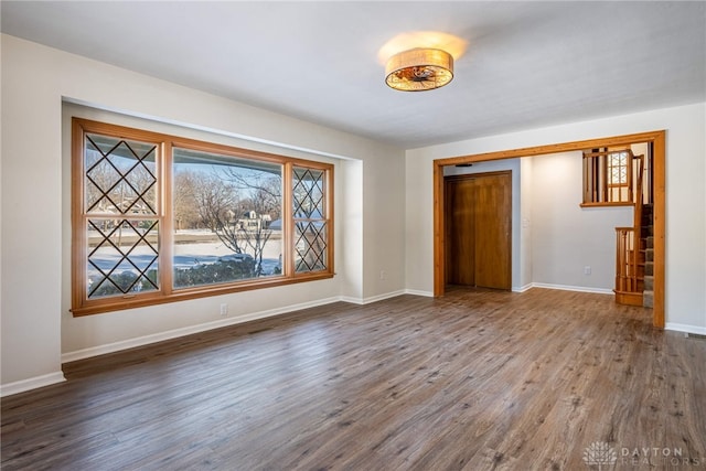 empty room featuring dark wood-type flooring