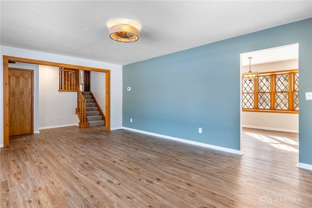 unfurnished living room with hardwood / wood-style flooring