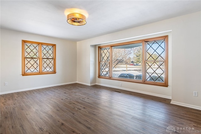 unfurnished room featuring dark hardwood / wood-style floors