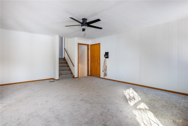 empty room with ceiling fan and carpet