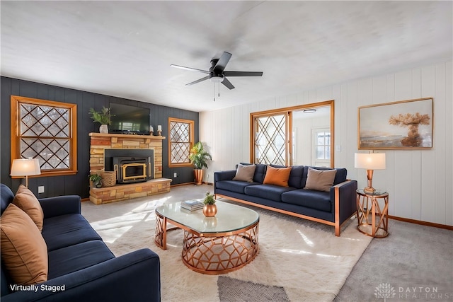 carpeted living room featuring ceiling fan