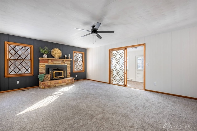 unfurnished living room with ceiling fan and light colored carpet