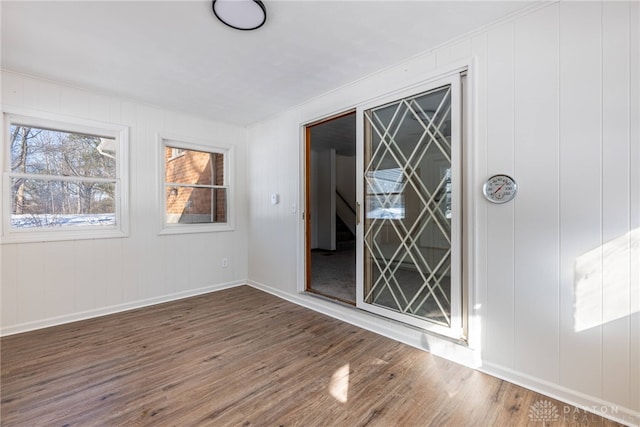 spare room with dark wood-type flooring