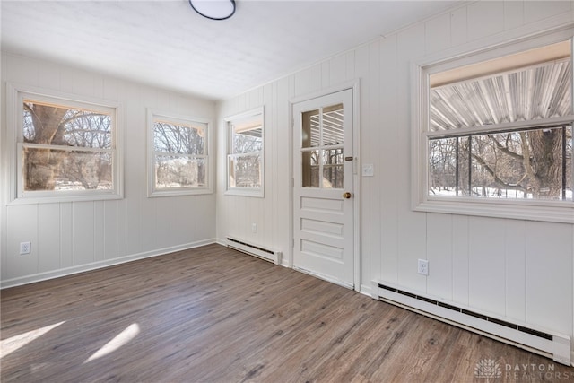 entrance foyer featuring baseboard heating and dark hardwood / wood-style flooring