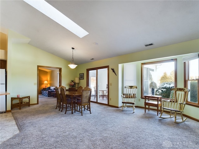 755 Willow Creek Way, Troy, OH 45373 - dining space featuring carpet floors, lofted ceiling, and a skylight