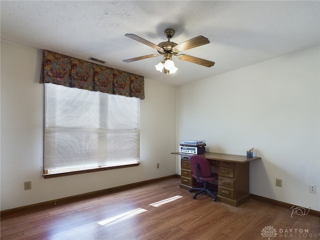 home office featuring ceiling fan and wood-type flooring