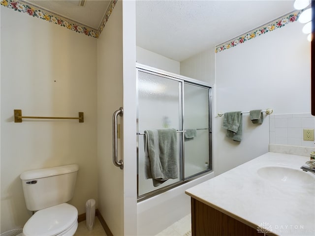 full bathroom with toilet, enclosed tub / shower combo, tasteful backsplash, and vanity