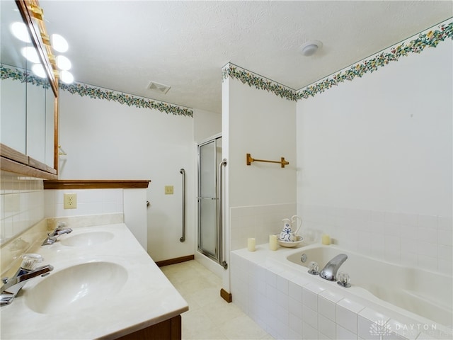 bathroom with vanity, plus walk in shower, and a textured ceiling