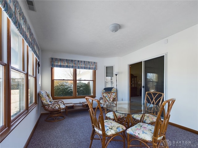 view of carpeted dining space