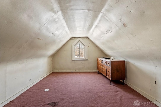 bonus room with carpet and lofted ceiling