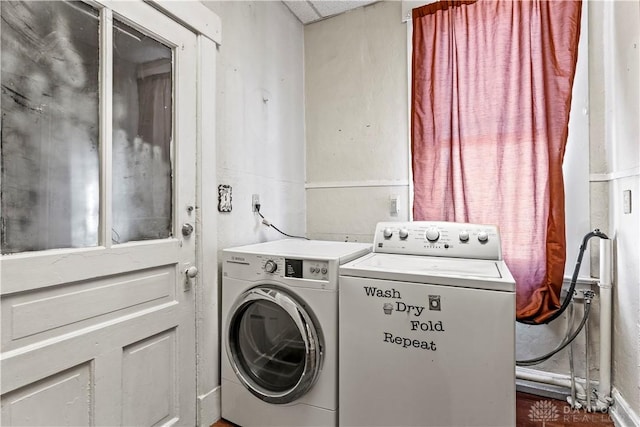 clothes washing area featuring washing machine and clothes dryer