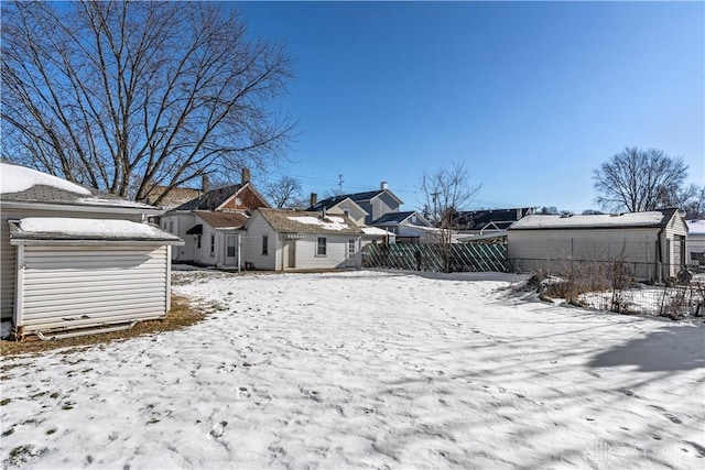 snowy yard with an outdoor structure