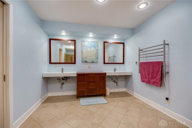 bathroom with radiator and tile patterned flooring