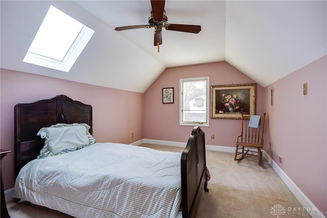 bedroom with ceiling fan, light colored carpet, and vaulted ceiling