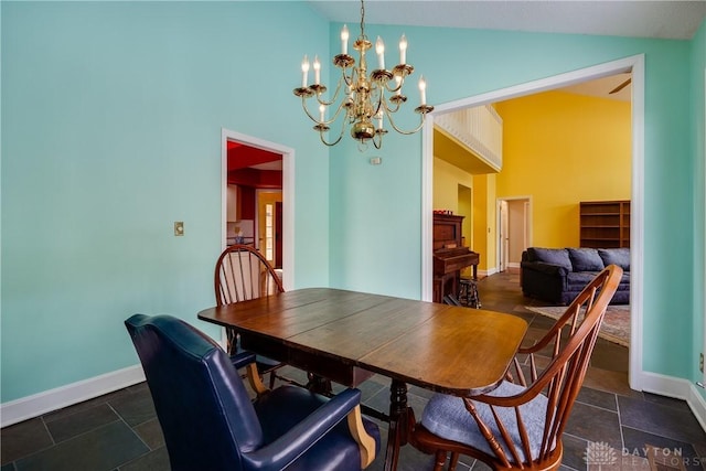 dining room with high vaulted ceiling and an inviting chandelier