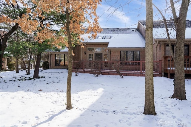 view of front facade featuring a wooden deck