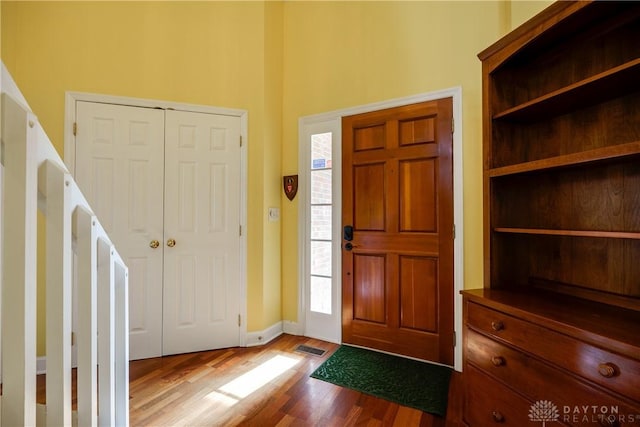 entryway featuring a wealth of natural light and light hardwood / wood-style flooring