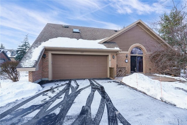 ranch-style house featuring a garage