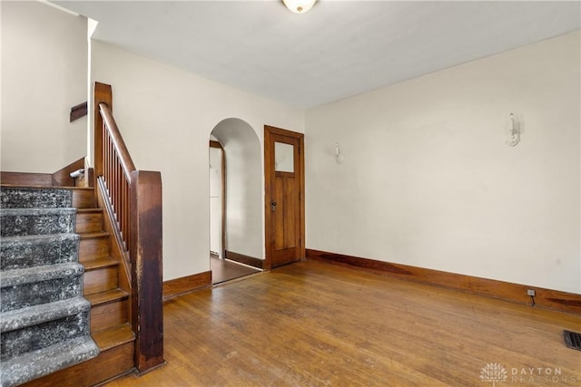 foyer entrance featuring wood-type flooring